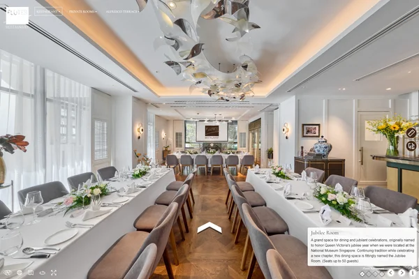 Restaurant virtual tour of Flutes Singapore Jubilee Room with white-clothed dining tables, floral centerpieces, and silver ceiling