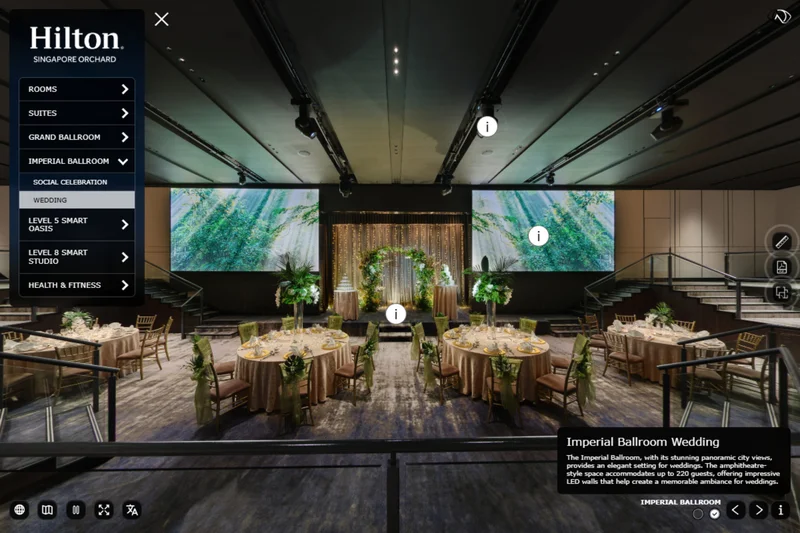 Hilton Singapore Orchard wedding ballroom with round tables, floral arch, fairy lights, and tropical LED screens on stage
