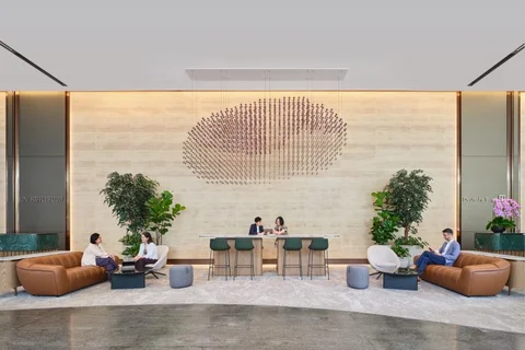 One Raffles Quay south tower office lobby with reception desk and lounge seating